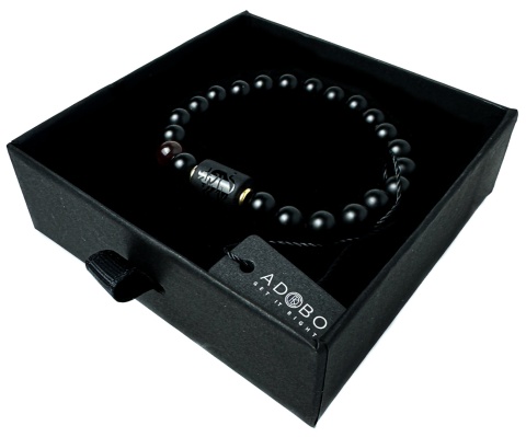 Czarna bransoletka kulkowa z obsydianu i skały wulkanicznej, z motywem znaku zodiaku byk