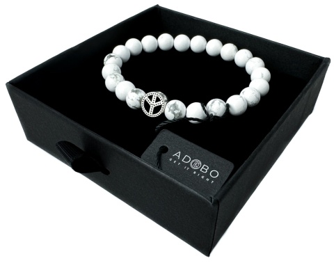 Biała bransoletka kulkowa ze splotem z howlitu i znakiem pacyfy