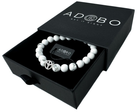 Biała bransoletka kulkowa ze splotem z howlitu i znakiem pacyfy