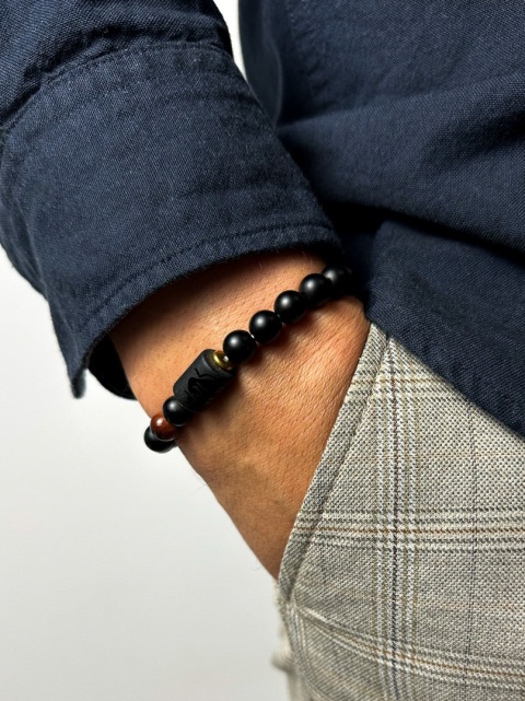 Czarna bransoletka kulkowa z obsydianu i skały wulkanicznej, z motywem znaku zodiaku byk